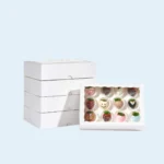 Minimalist white cookie packaging box with secure tuck-in lid